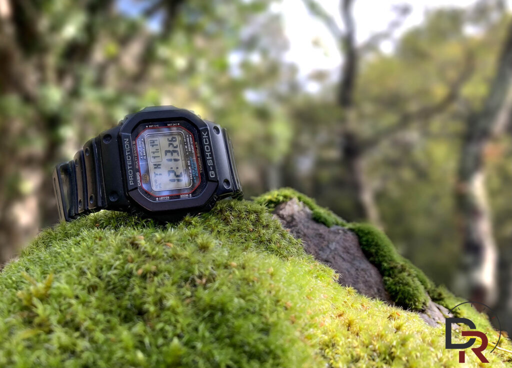 Casio G-Shock GW-M5610 resting on moss in the wild
