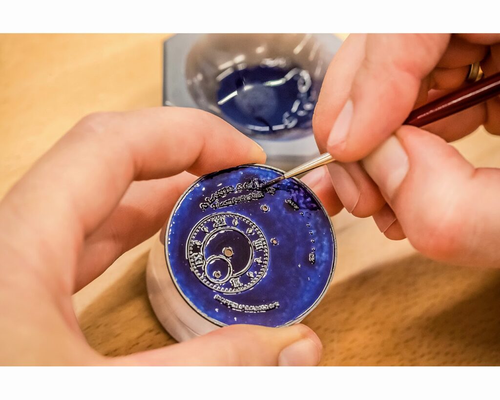 Applying enamel paste to dial cells