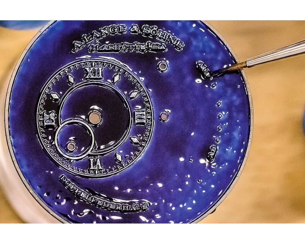 Detailing dial apertures with fine brush