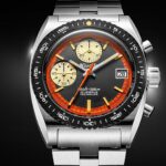 Reloj Nivada Grenchen Autochron Orange Automatic Ref. 77004A10 con esfera negra y naranja en degradado