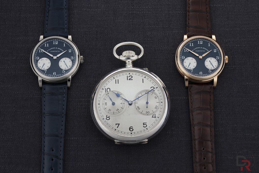 A. Lange & Söhne 1815 UP/DOWN in white gold and pink gold alongside the historic pocket watch that inspired its design