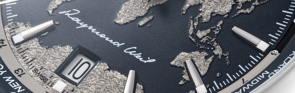 Detalle macro del mapa del mundo en relieve del RAYMOND WEIL Freelancer World-Traveller